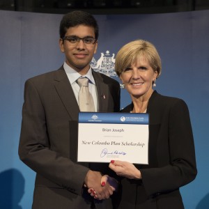 QuT student Brian Joseph receives his New Colombo Plan Scholarship certificate from Foreign Minister Julie Bishop 