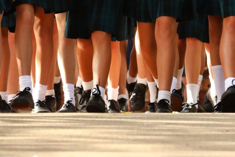 Group of kids in school uniform walking together