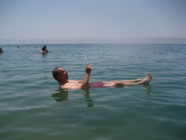 'Dead Sea, man reading' by  Arian Zwegers (CC BY 2.0) 